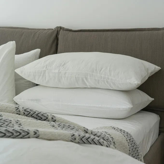 photo of a bed piled with pillows