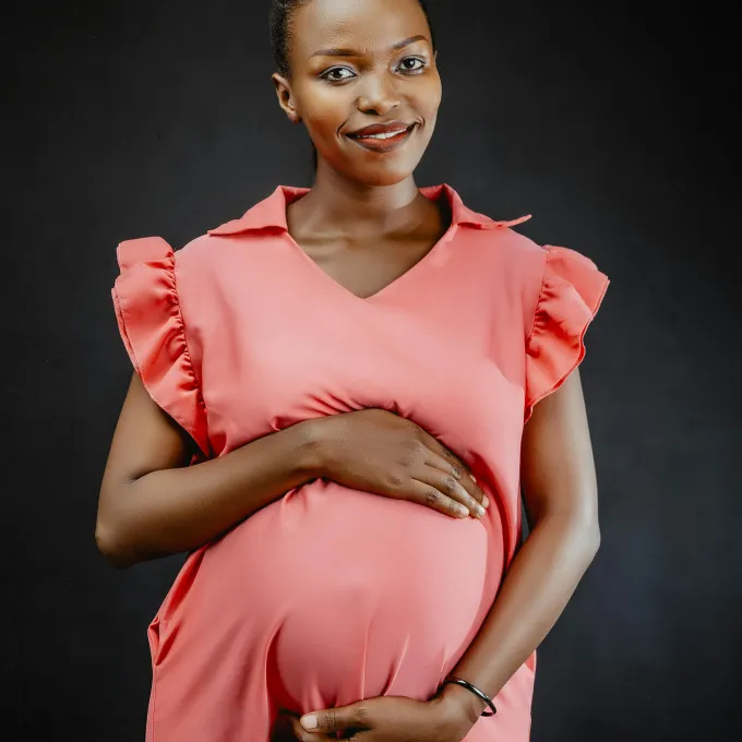 pregnant woman holding her belly