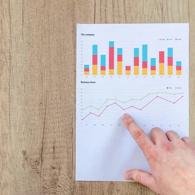 a hand point at a graph