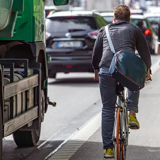 Cyclists navigate a busy roadside bike path — a visible reminder of progress in integrating physical activity into urban design. (Photo: Shutterstock)
